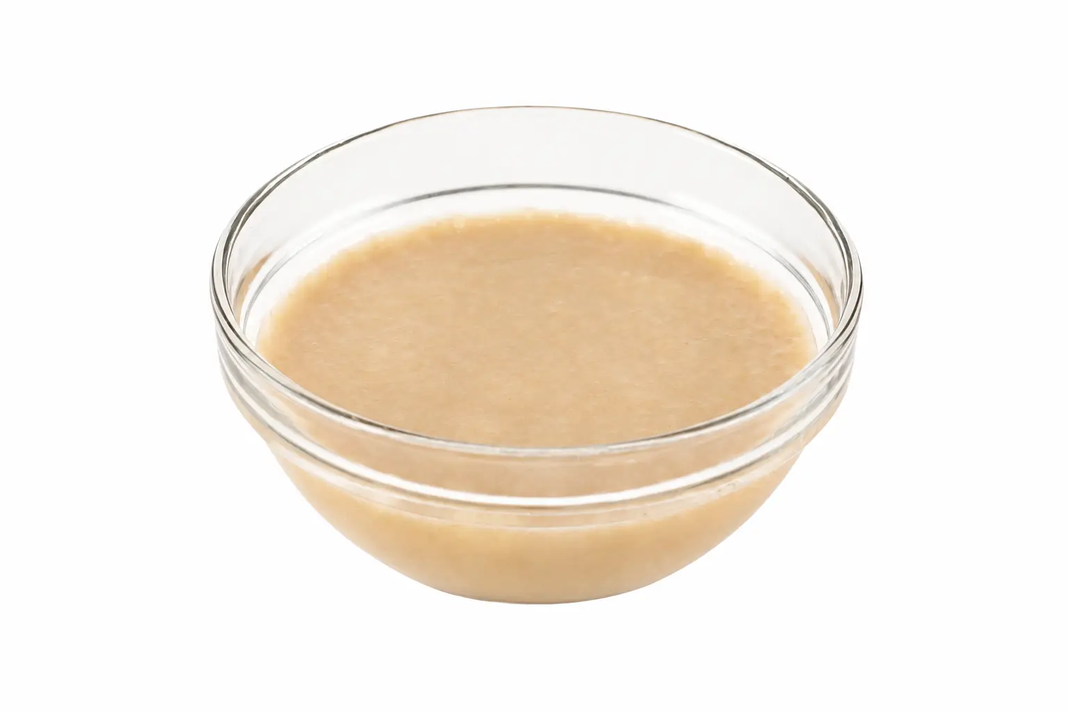 Light, creamy regenerative organic banana puree in a glass bowl